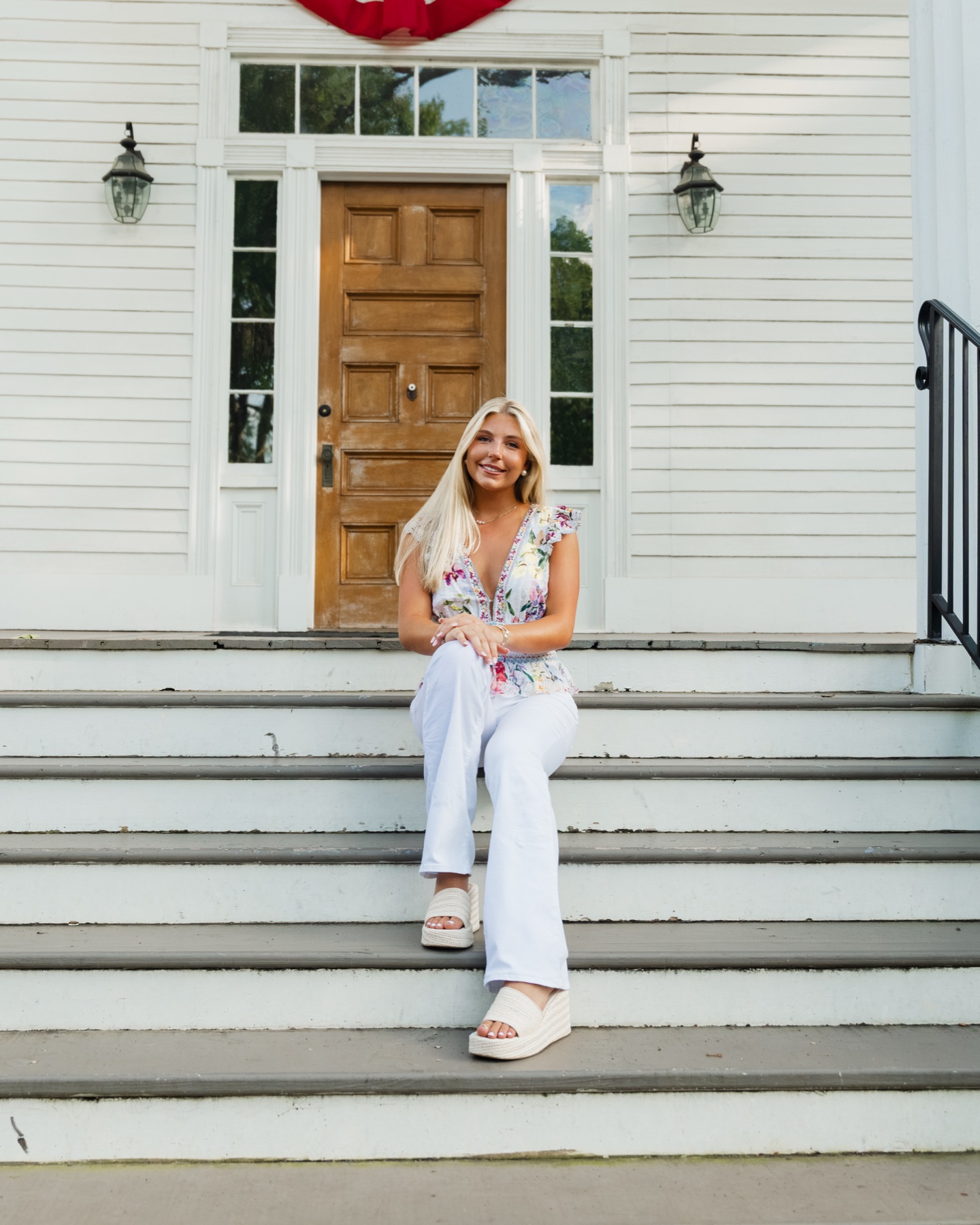 Senior portrait seated on the front steps