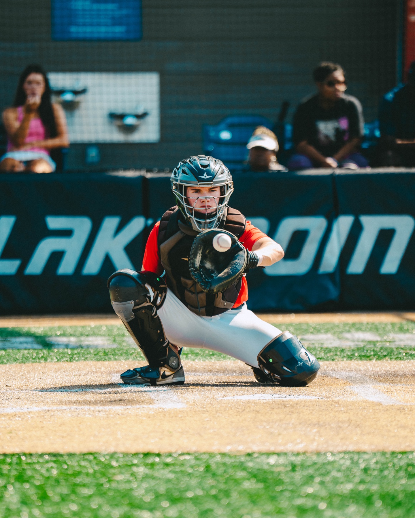 Baseball catcher receiving a pitch