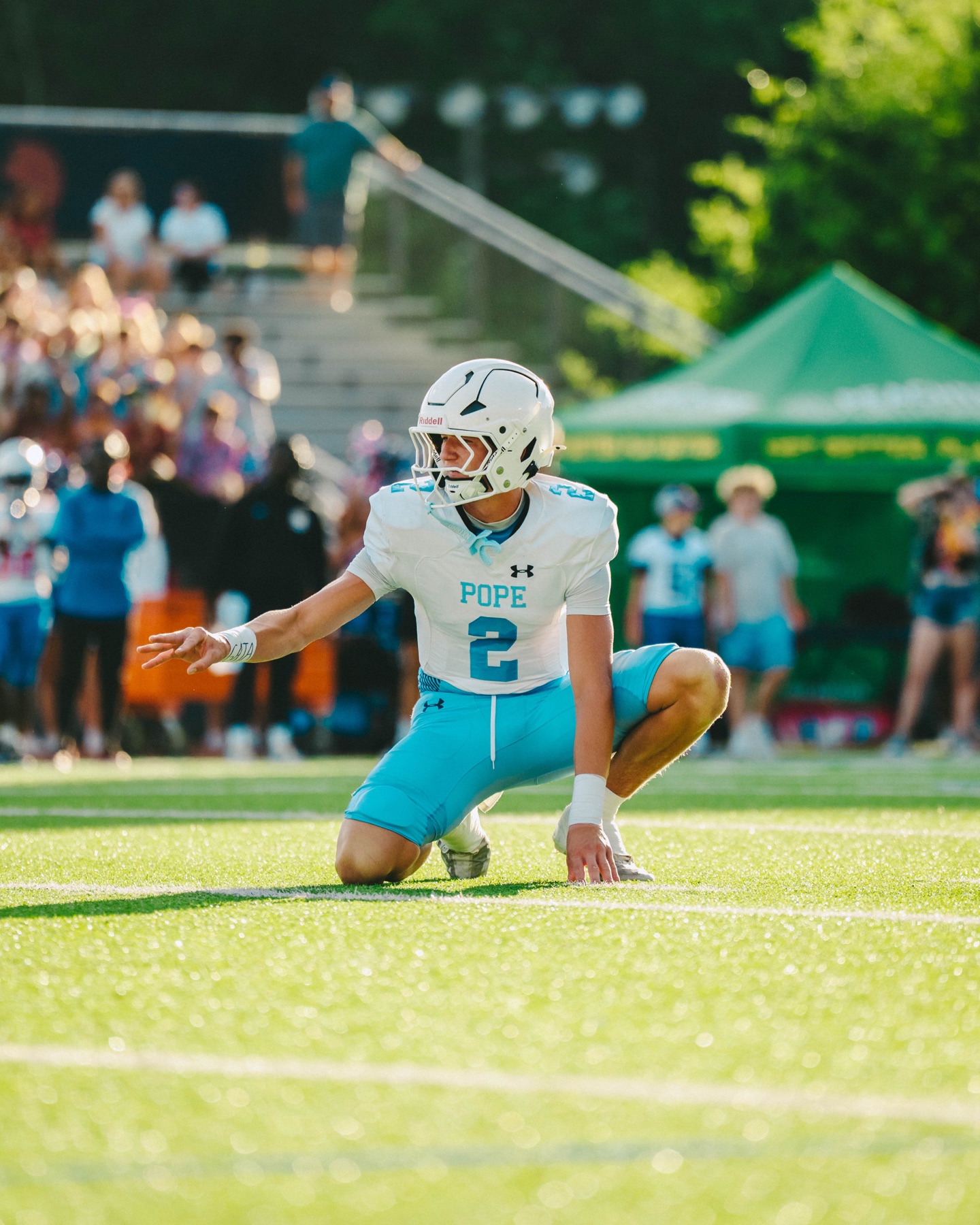 Football player warming up on the field