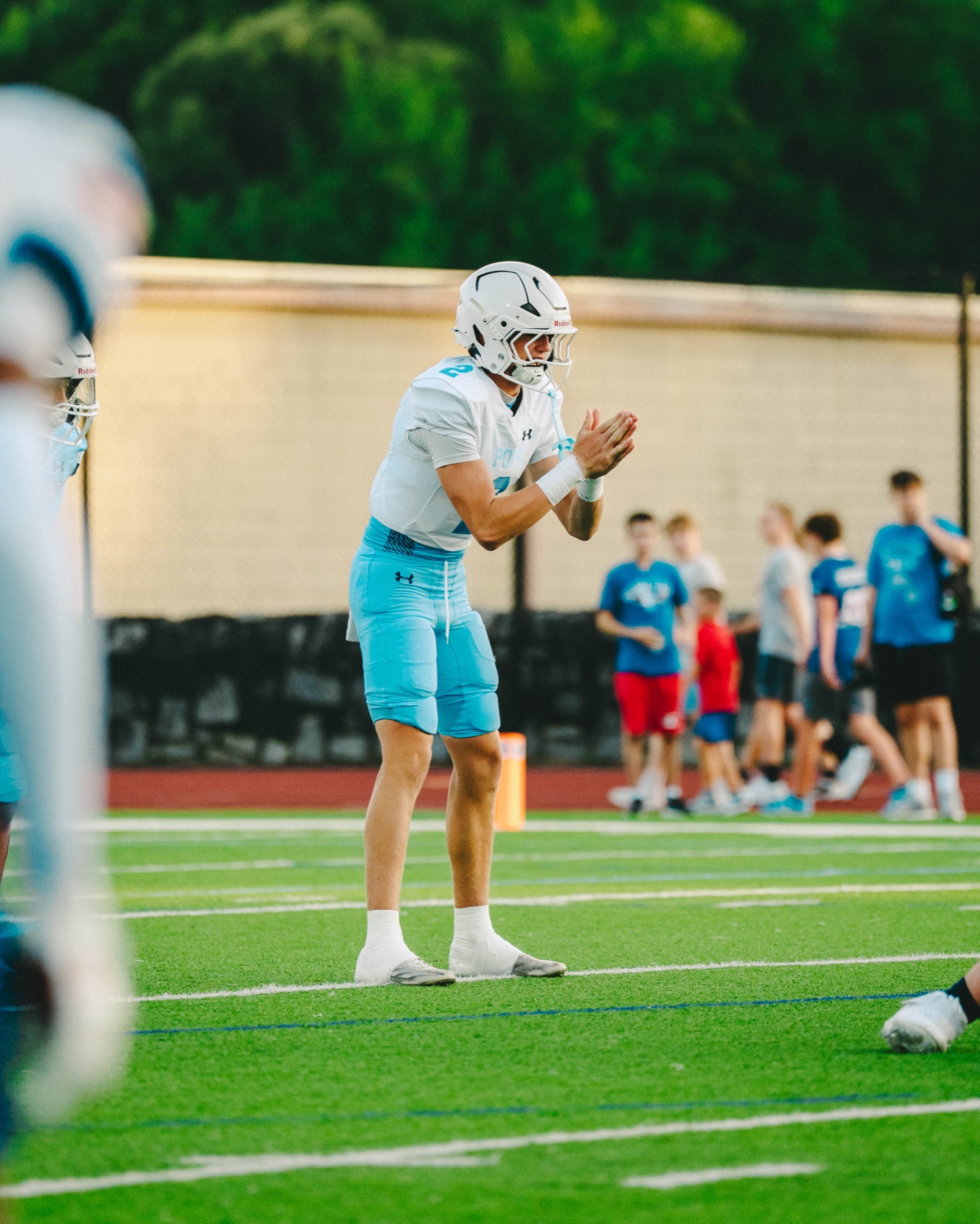 Football quarterback calling for the snap