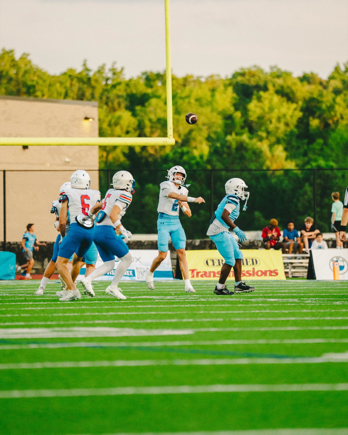 Football quarterback throwing a pass