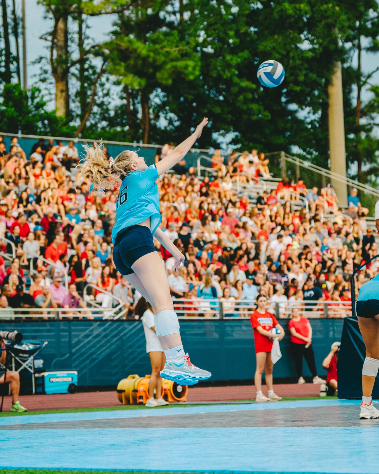 Volleyball player jumping to hit the ball